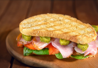 Sandwich with bacon and vegetables