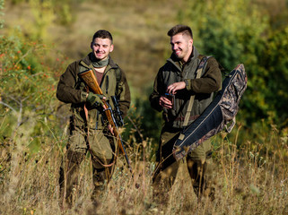 Man hunters with rifle gun. Boot camp. Hunting skills and weapon equipment. How turn hunting into...