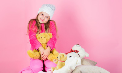 Unique attachments to stuffed animals. Kid little girl play with soft toy teddy bear pink background. Child small girl playful hold teddy bear plush toy. Teddy bears improve psychological wellbeing