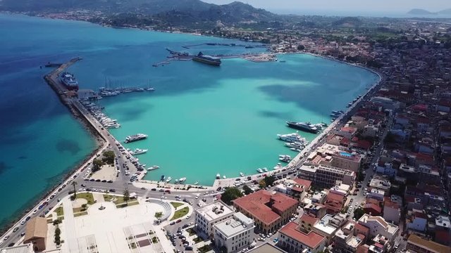 Aerial drone top view video of iconic main picturesque city and port of Zakynthos island with deep turquoise sea color, Ionian, Greece