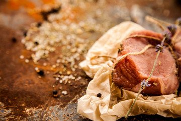 Raw fresh lamb meat and cleaver on dark background