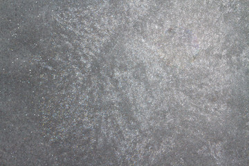 Frozen window photographed in the evening with a flicker of color