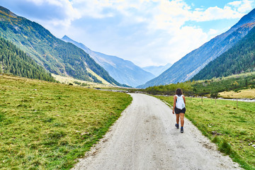 Hiking and biking on a trail in Krimml valley in Austria