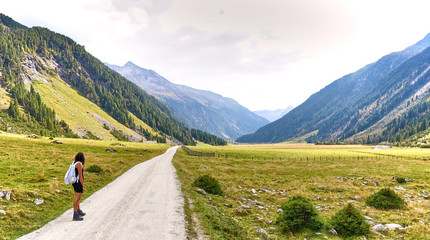 Fototapeta na wymiar Hiking and biking on a trail in Krimml valley in Austria