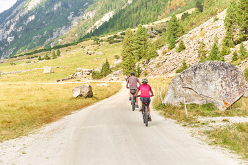 Obraz premium Hiking and biking on a trail in Krimml valley in Austria