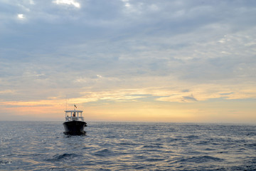 Obraz premium Yacht in the sea. Waves on the sea. Travels. Sunset. Relaxation. tourism