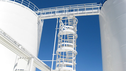 The tank with water and a ladder.