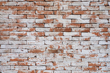 Background of old vintage brick wall with peeling white, texture.