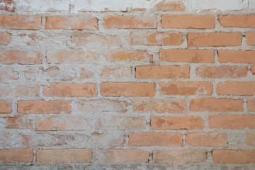 Old brick wall in antiquity and was damaged