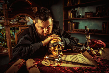 Necromancy sorcerer casting black magic spell using blind skull