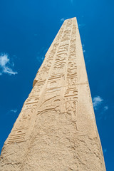 Obelisk with hieroglyphics and ancient egyptian Karnak Temple