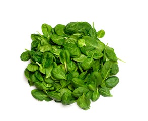 handful fresh green spinach on white isolated background
