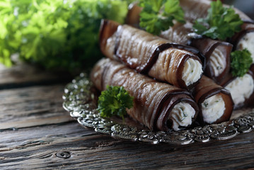 Eggplant rolls stuffed with cheese and garlic.