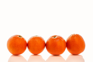 Whole oranges in peel isolated on white background