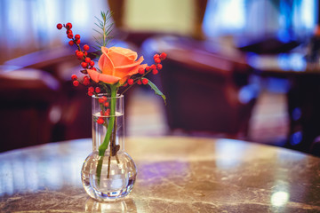 restaurant interior table set for meal, Beautiful rose in a decanter