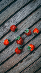 solated strawberries. Falling strawberry fruits whole and cut in half isolated on white background with clipping path - Imagen