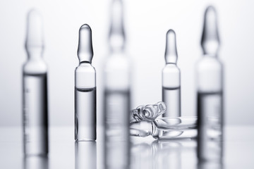 Medical ampules for injections on a white background.