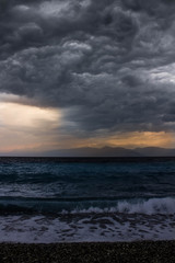 Obraz premium ocean with waves and dark clouds above before the storm beach