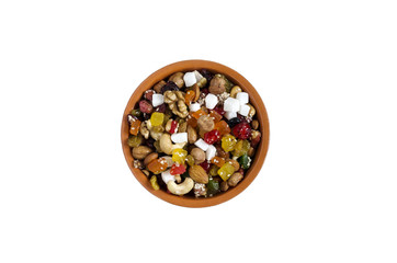 Dried fruit and nuts in a Cup on white background top view isolate