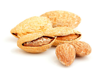 Salty almonds closeup isolated.