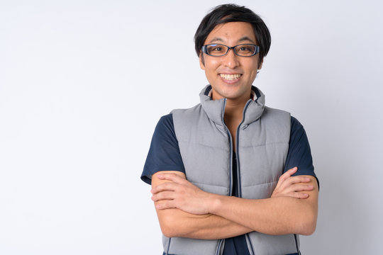 Portrait Of Happy Japanese Man With Arms Crossed Ready For Hiking