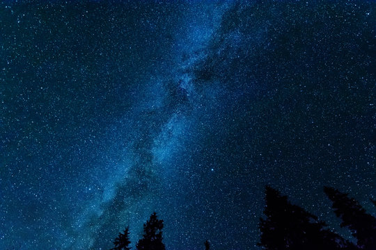 Bright night starry sky with millions of stars and galaxy Milky Way.