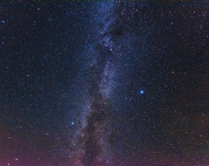 Bright night starry sky with millions of stars and galaxy Milky Way.