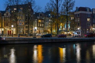 Fototapeta premium City scenic from Amsterdam in the Netherlands at sunset