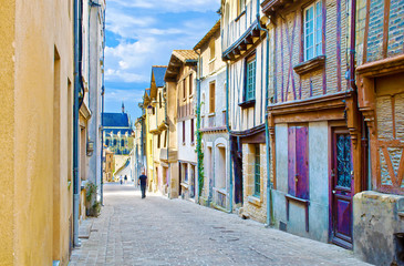 One man walking down Rue de Chateau street