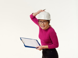 emotional girl foreman in a helmet on a white background.