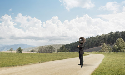 Businessman with old TV instead of head.