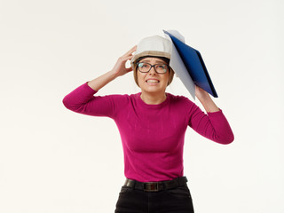 emotional girl foreman in a helmet on a white background.