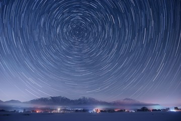 Star trails over 3 snowy peaks of Mt. Hiruzen