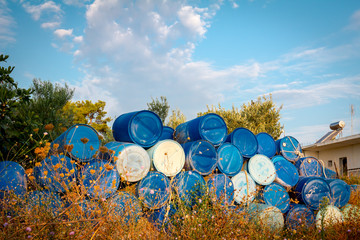 Plastic storage of drums, big blue barrels stacked up
