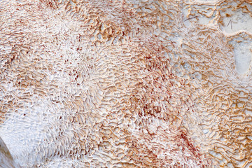 Natural travertine pools and terraces in Pamukkale in Turkey. Calcium deposits on travertine turquoise terraces at Turkey. Attractions resort town.