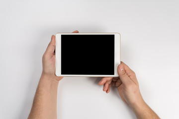 Man working with tablet, top view