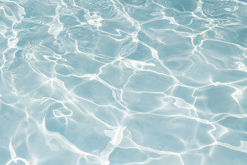 Texture of water in swimming pool for background