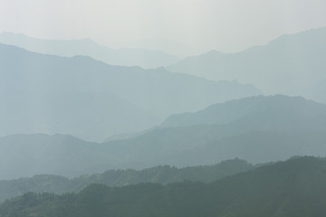 Landscape layers mountains in haze at Longshen China