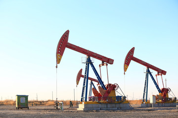 Pumping units at work in the blue sky background