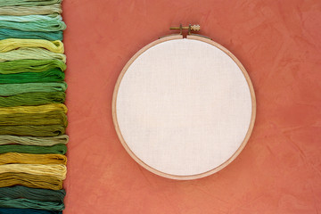 embroidery hoop with canvas and  threads