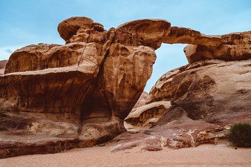 View through a rock arch in the desert of Wadi Rum, Jordan, Middle East