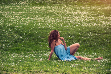 serene and calm mid aged woman walking and resting barefoot in public park