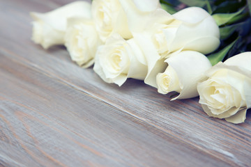 White Rose. A bouquet of delicate roses on a white background. Place for text, close-up. Romantic background for spring holidays.