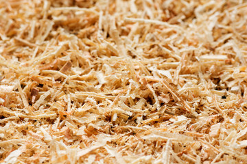 Wooden sawdust texture close up. Abstract background.