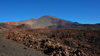 Volcanic landscape with lava Aa at Montaña Samara hike, one of the most unusual alien-like environment found at Teide National Park, with views towards Pico del Teide, Pico Viejo and Las Cuevas Negras