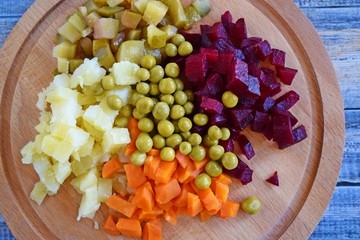 Chopped the ingredients for salad on a wooden Board.Vegetarian food.