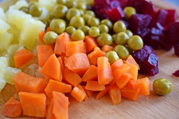 Chopped the ingredients for salad on a wooden Board.Vegetarian food.