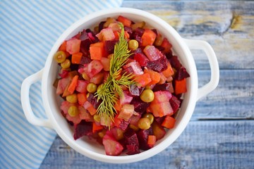 Vegetable salad with carrots and beets.Vinaigrette on a white plate.Vegetarian food.