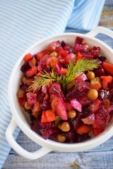 Vegetable salad with carrots and beets.Vinaigrette on a white plate.Vegetarian food.