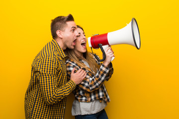 Couple in valentine day shouting through a megaphone